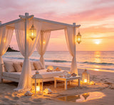 luxury beach sunset photography backdrop with white cabanas and lanterns