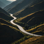 A dramatic mountain pass with winding roads and a breathtaking view of the valley below (2)