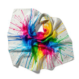 This image showcases a cross-section of a spiral shell featuring a mesmerizing array of colors and intricate patterns. The vibrant hues range from pink, blue, and green near the center to yellow, orange, and brown towards the outer edges, creating a stunn