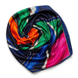 This image showcases a cross-section of a spiral shell featuring a mesmerizing array of colors and intricate patterns. The vibrant hues range from pink, blue, and green near the center to yellow, orange, and brown towards the outer edges, creating a stunn