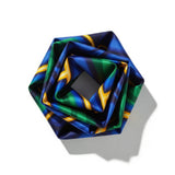 This image showcases a cross-section of a spiral shell featuring a mesmerizing array of colors and intricate patterns. The vibrant hues range from pink, blue, and green near the center to yellow, orange, and brown towards the outer edges, creating a stunn
