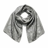 Elegant scarf with intricate knotted design and floral accents isolated on transparent background
