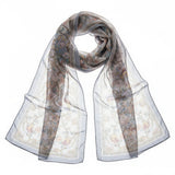 Elegant scarf with intricate knotted design and floral accents isolated on transparent background