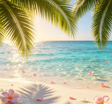 tropical paradise photography backdrop with oversized palm leaves and floating flower petals