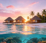 luxury Maldives-inspired beach photography backdrop with overwater bungalows and sunset reflections