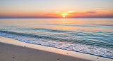 Beautiful twilight scene with soft waves meeting the shore under a colorful sky, evoking peace and tranquility.