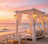 luxury beach sunset photography backdrop with white cabanas and lanterns