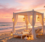 luxury beach sunset photography backdrop with white cabanas and lanterns