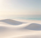 minimalist luxury beach photography backdrop with smooth white sand dunes and calm pastel ocean tones